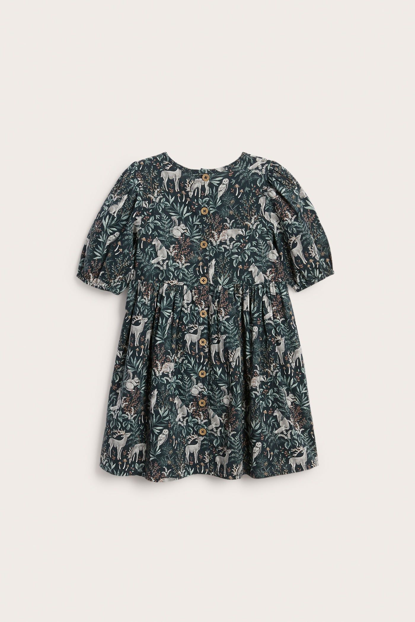 Front view of a kid's dark green woodland animal print dress with short puffed sleeves and buttons.