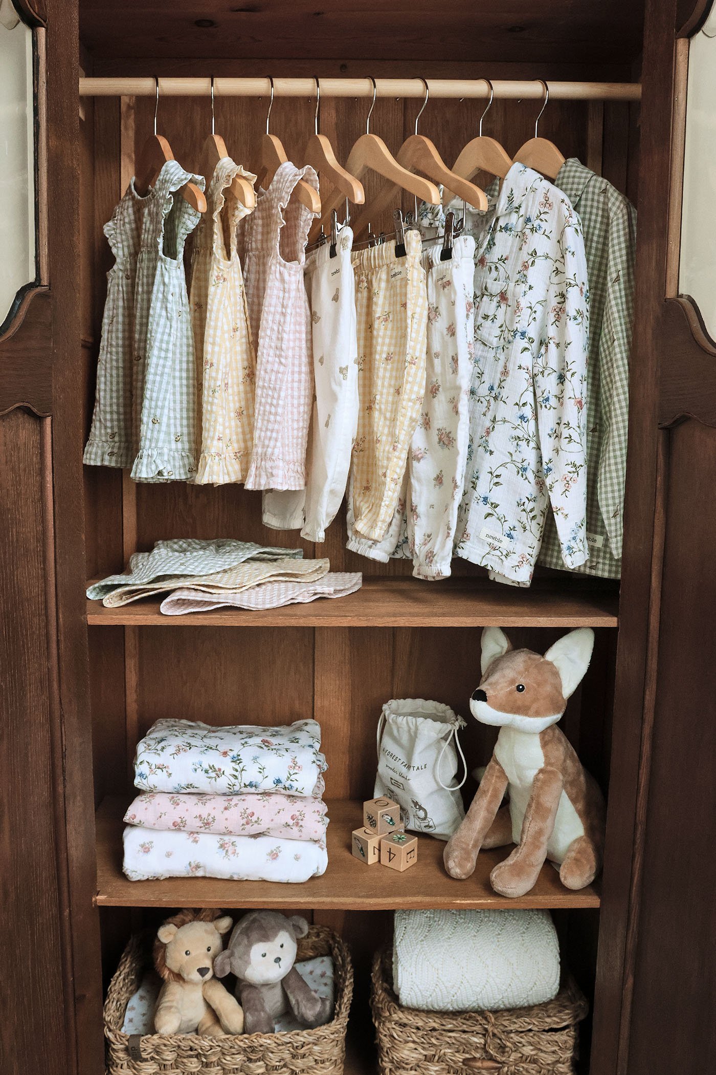 Beautiful patterned kids’ clothing in a wardrobe
