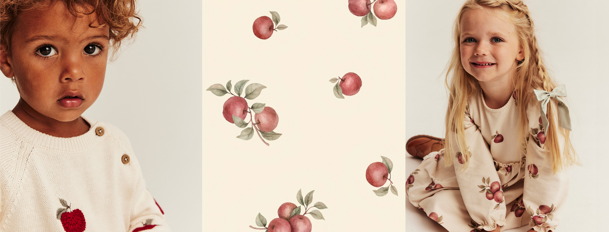 Watercolor pattern featuring red apples with green leaves scattered across a soft cream background.