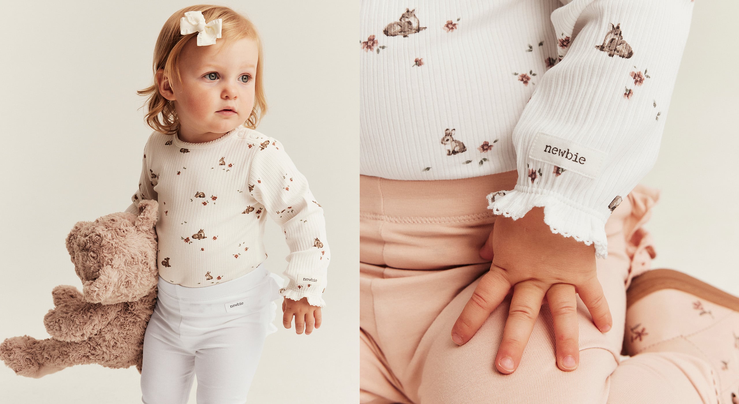 Baby ribbed long-sleeve top with small floral and rabbit print and lace cuffs, paired with white leggings and teddy bear.
