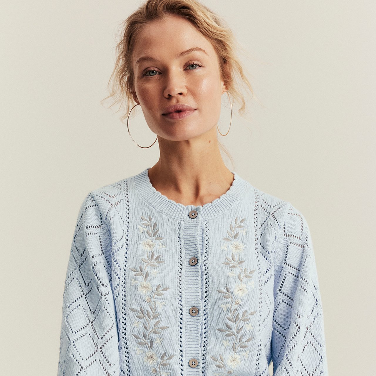 Woman wearing a blue cardigan