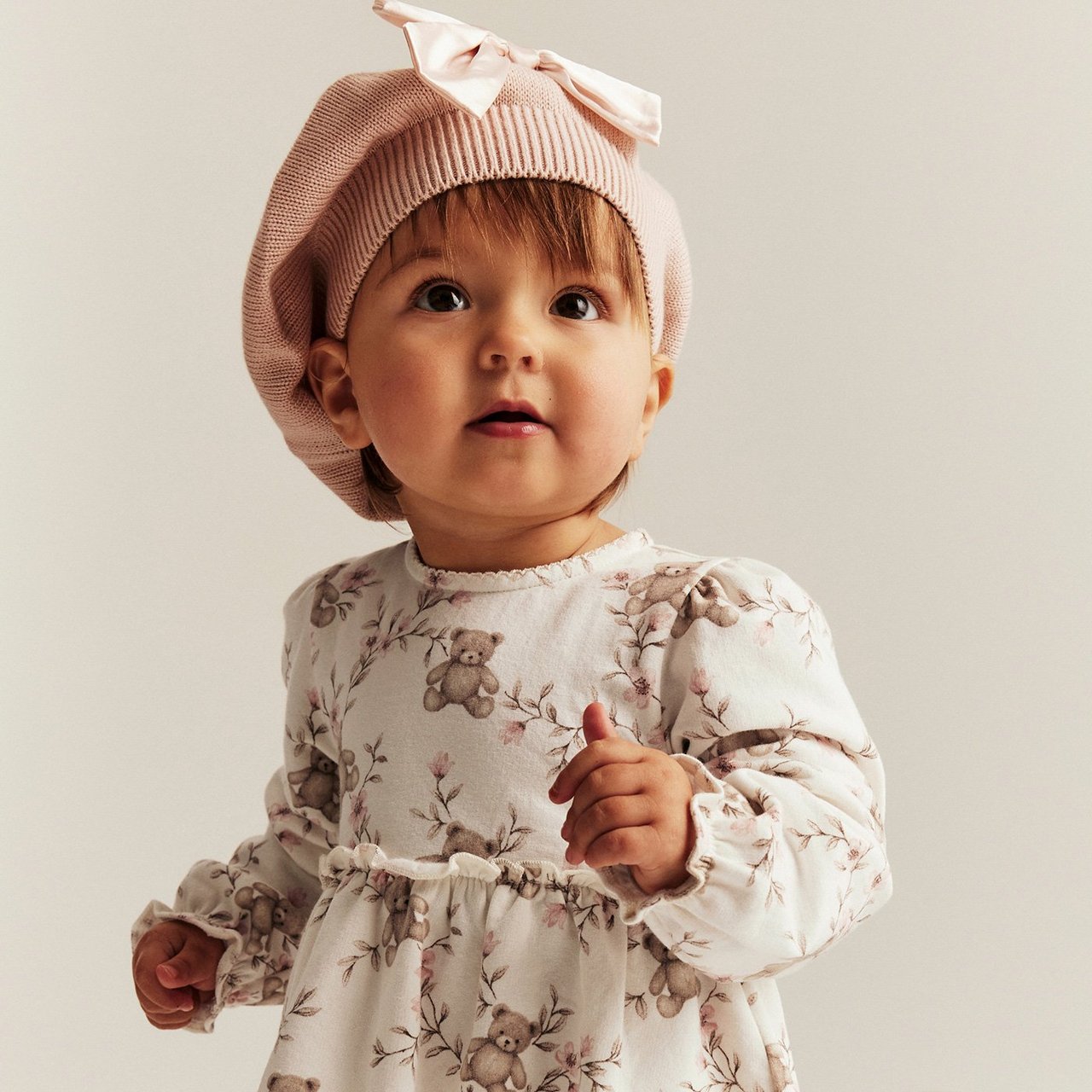 Baby girl wearing a red velour dress