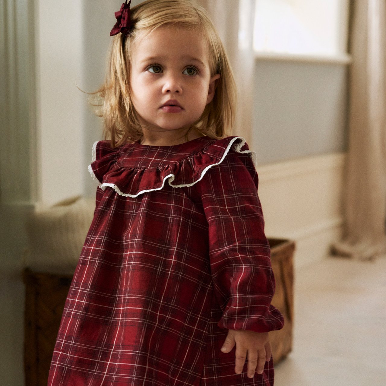 boy wearing a christmas hat and cardigan