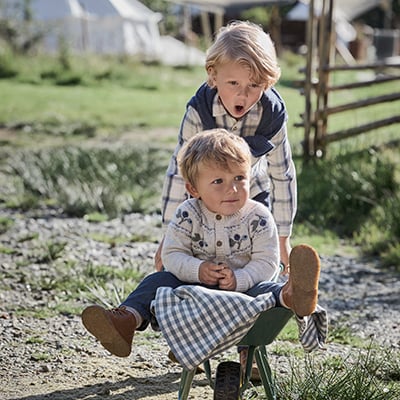  Boys playing with a wheelbarrow