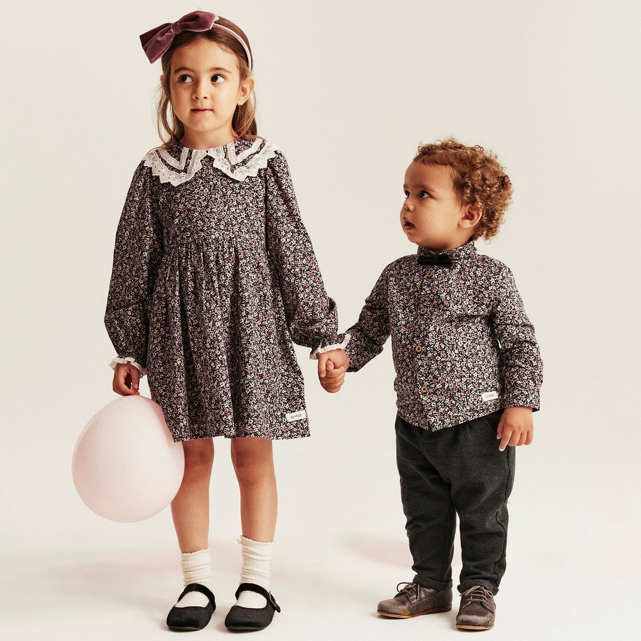Siblings in matching outfits
