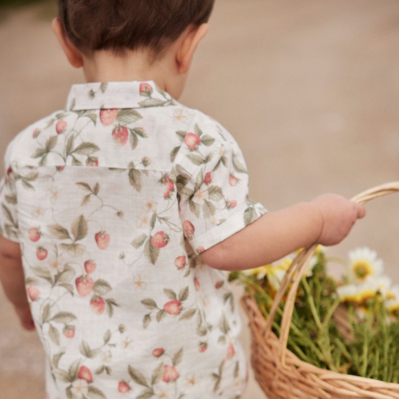 Boy in strawberry printed shirt