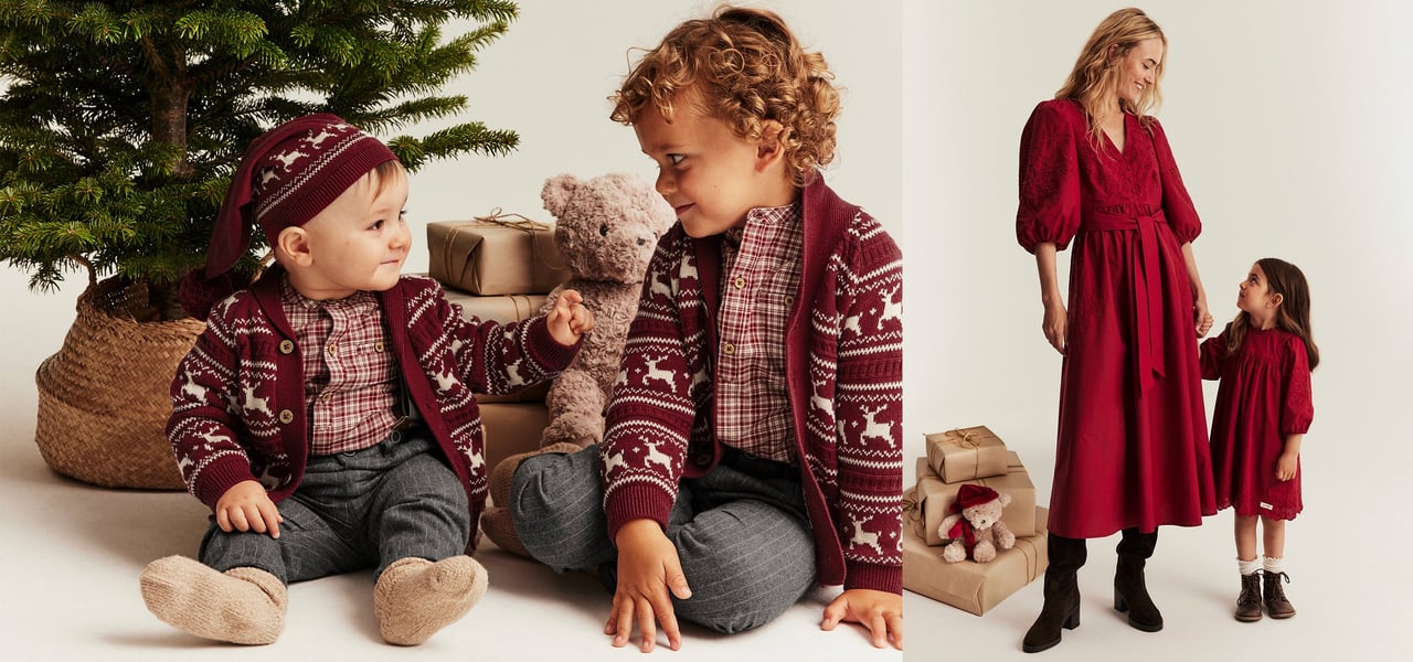 Kids and woman in matching festive outfits by the Christmas tree.