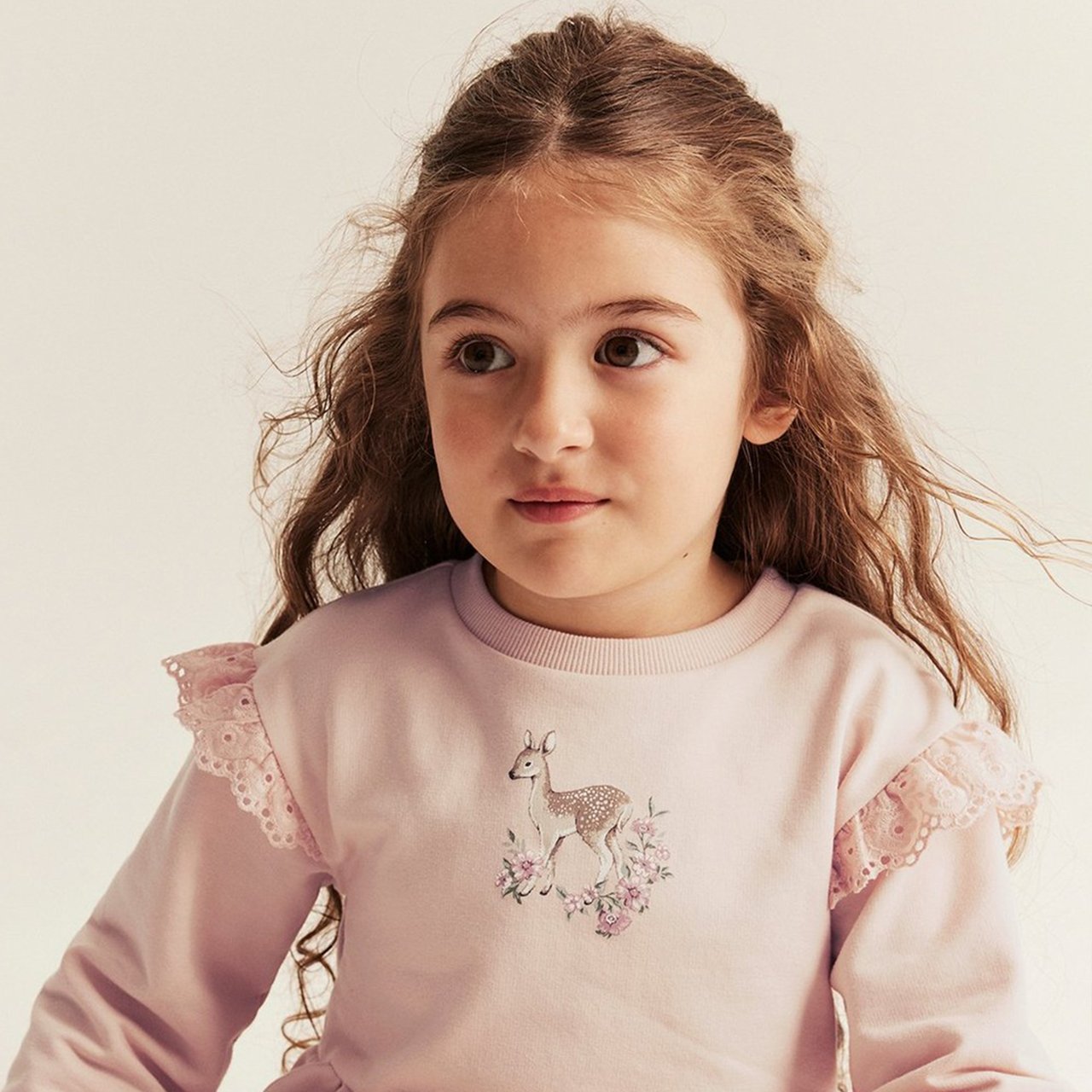 Girl in pink sweatshirt