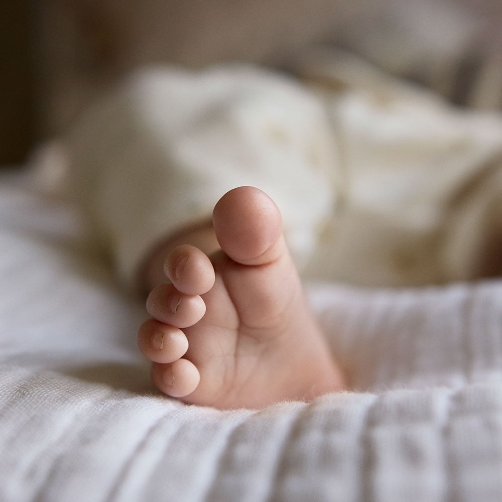 Newborn baby sleeping  in a cosy bed