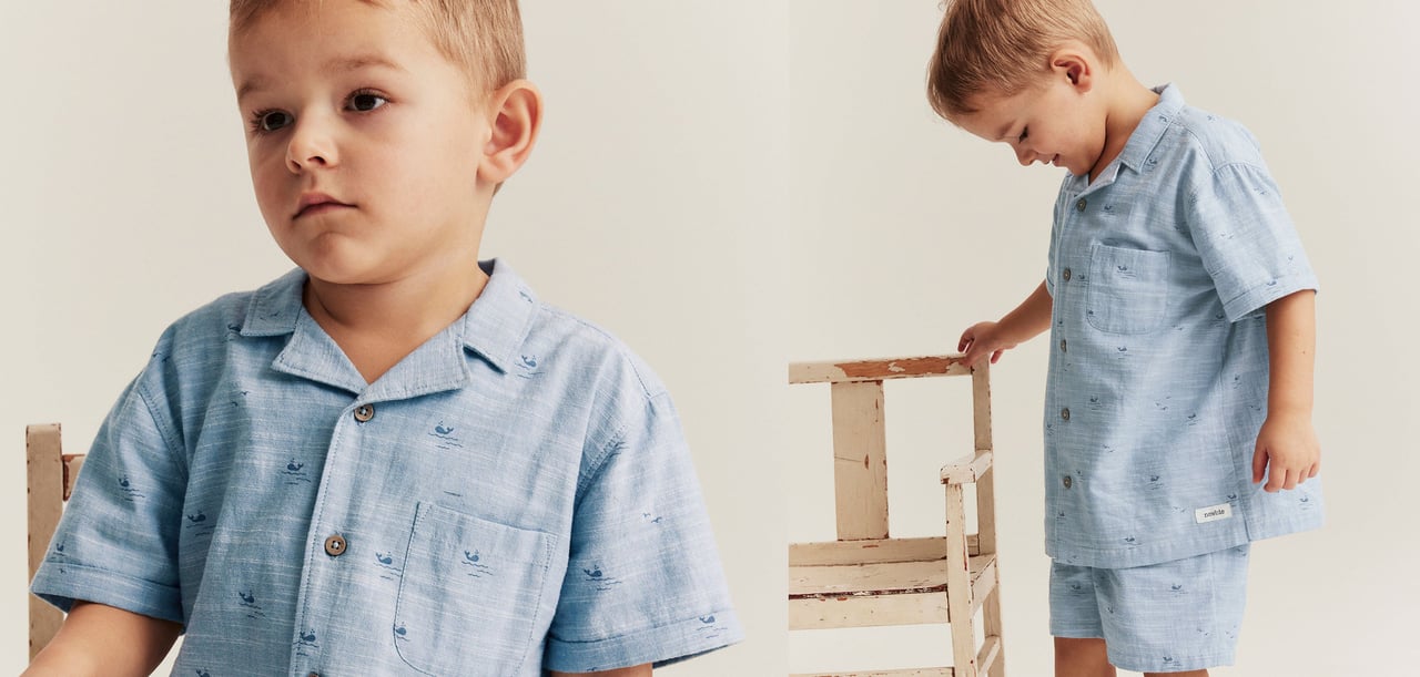 Boy in blue summer shirt and shorts
