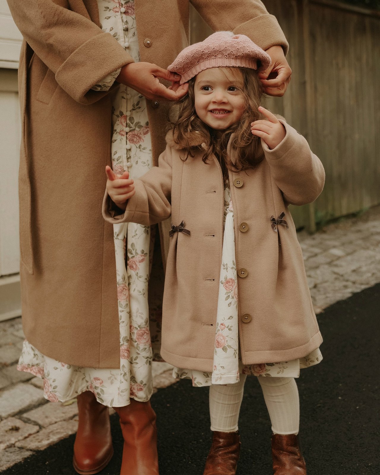 Little girl wearing a coat and hat