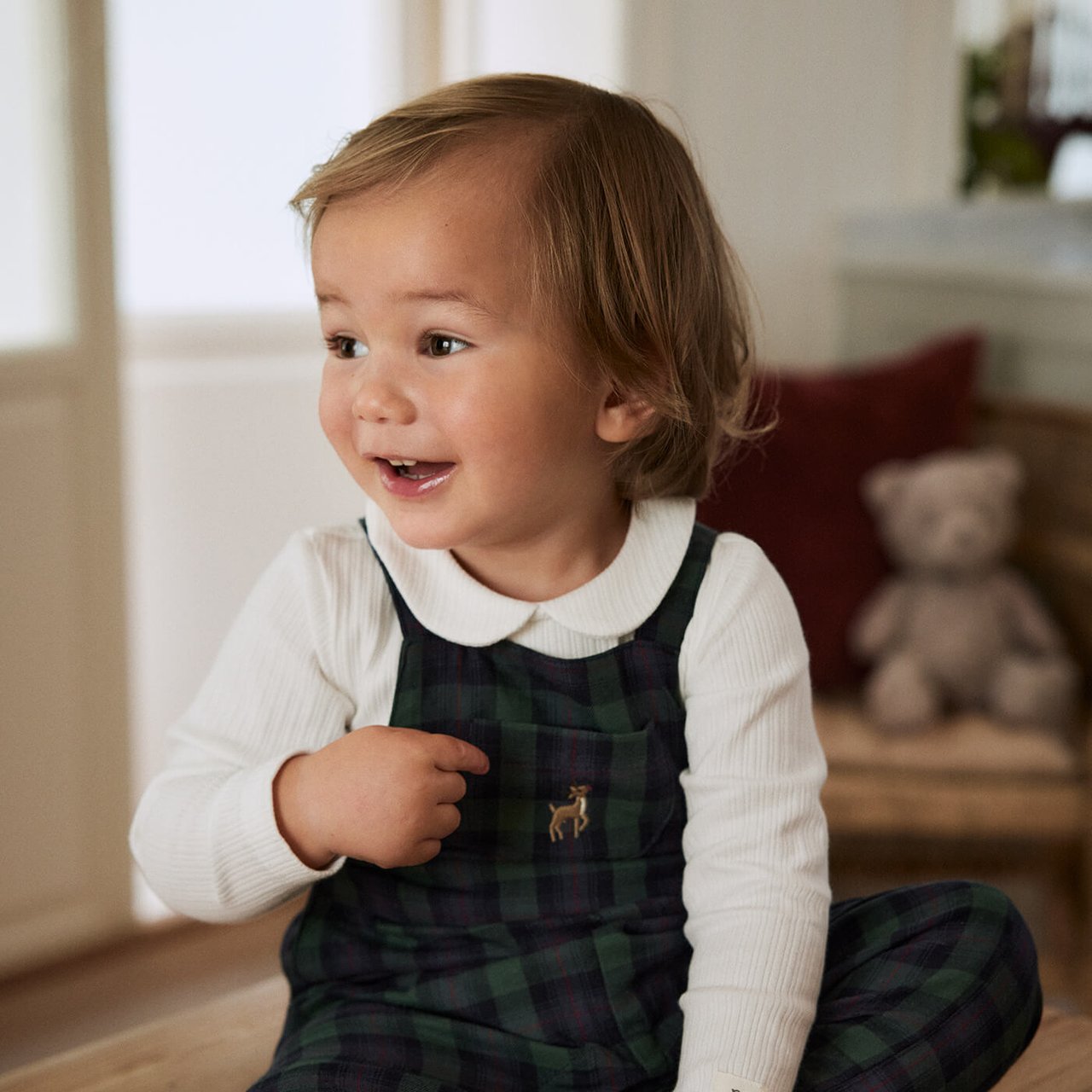 boy wearing a christmas hat and cardigan