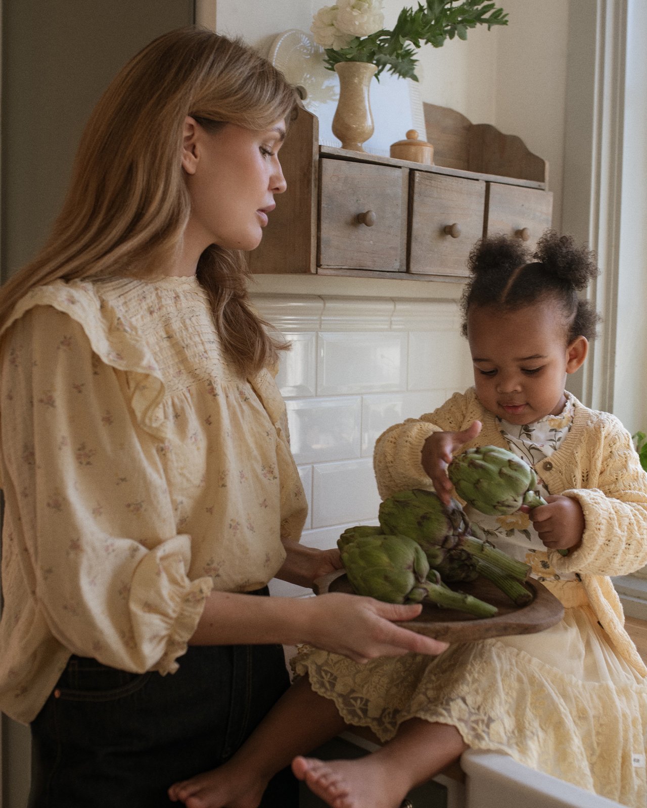 Mother and daughter in yellow clothes