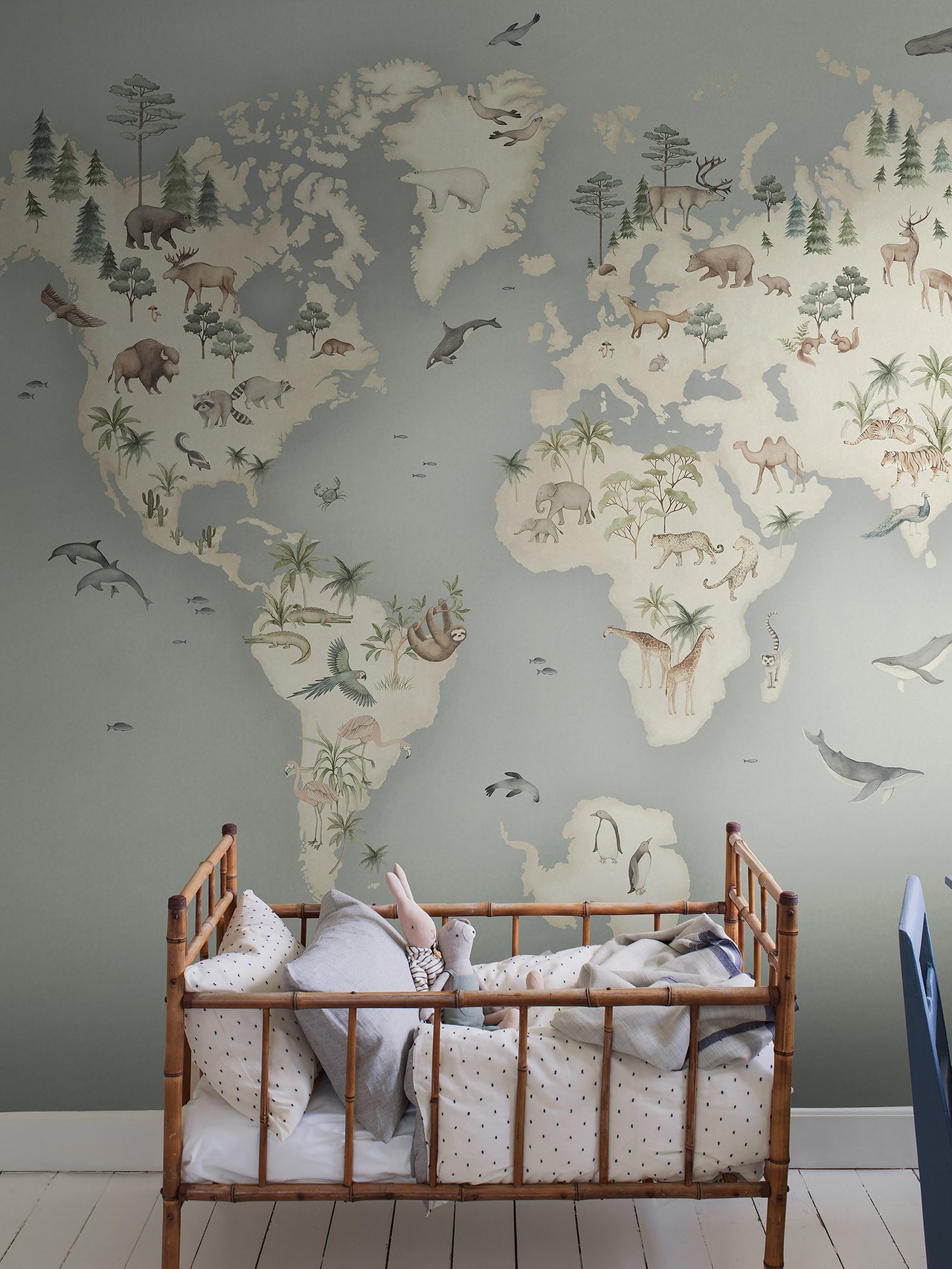 Wallpaper behind a baby bed