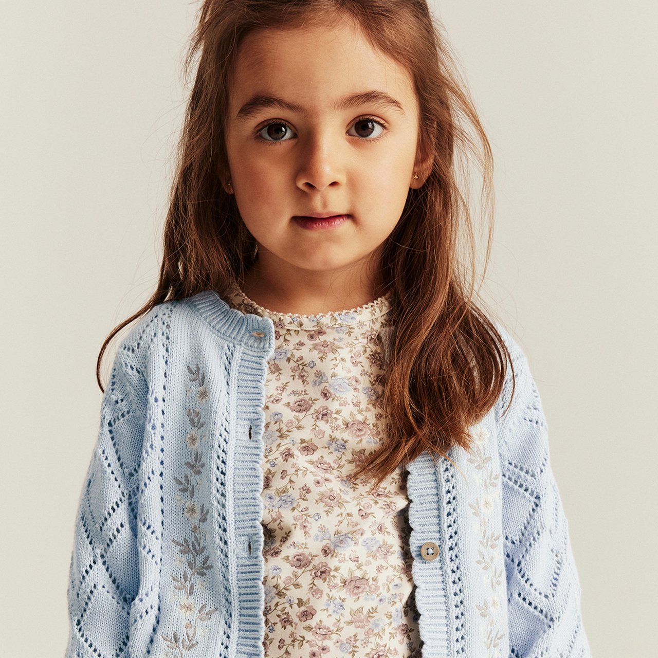 Girl wearing a blue cardigan