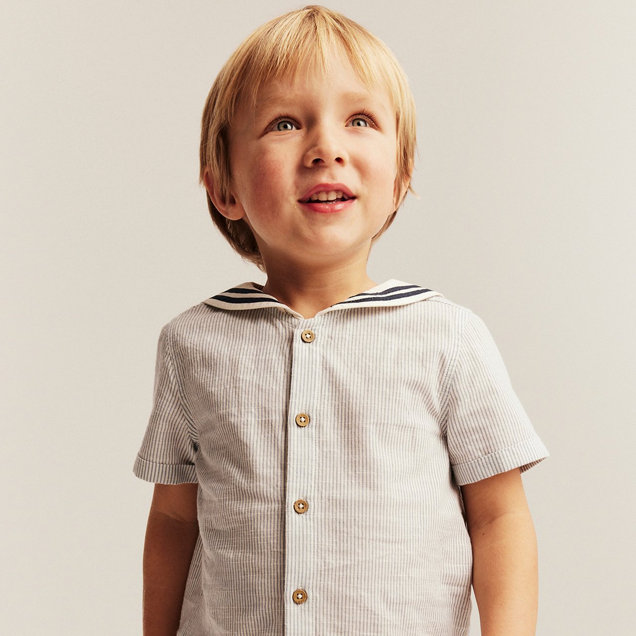 Boy wearing a shirt with a teddybear on it