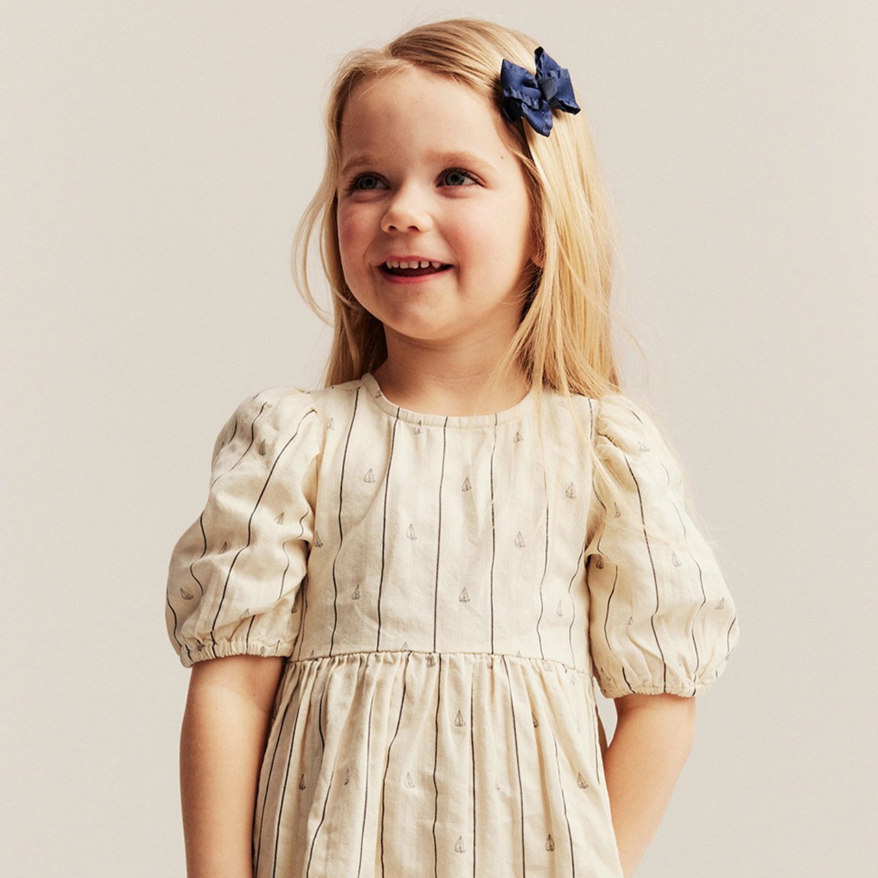 Girl wearing a blue cardigan