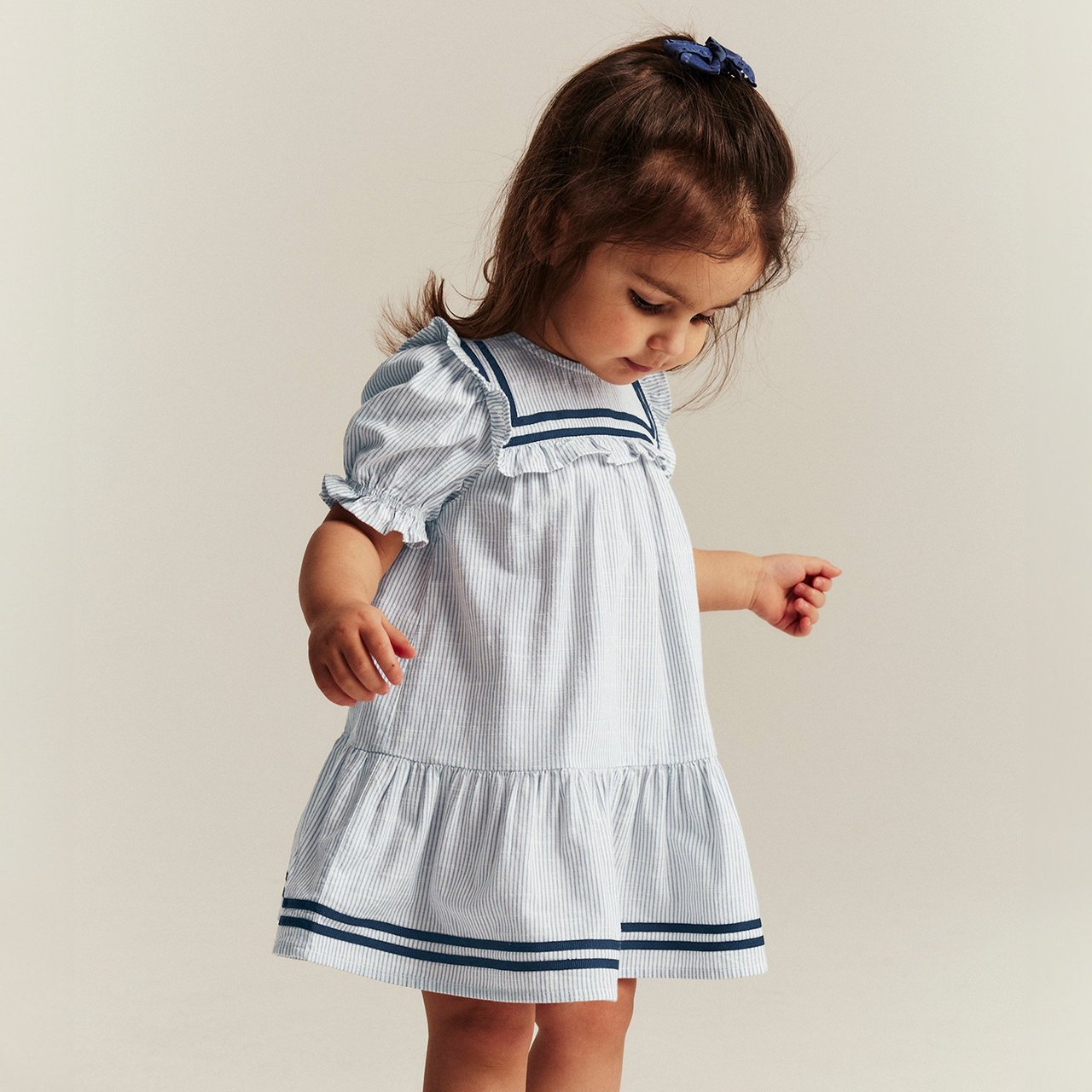 Girl in sailor dress
