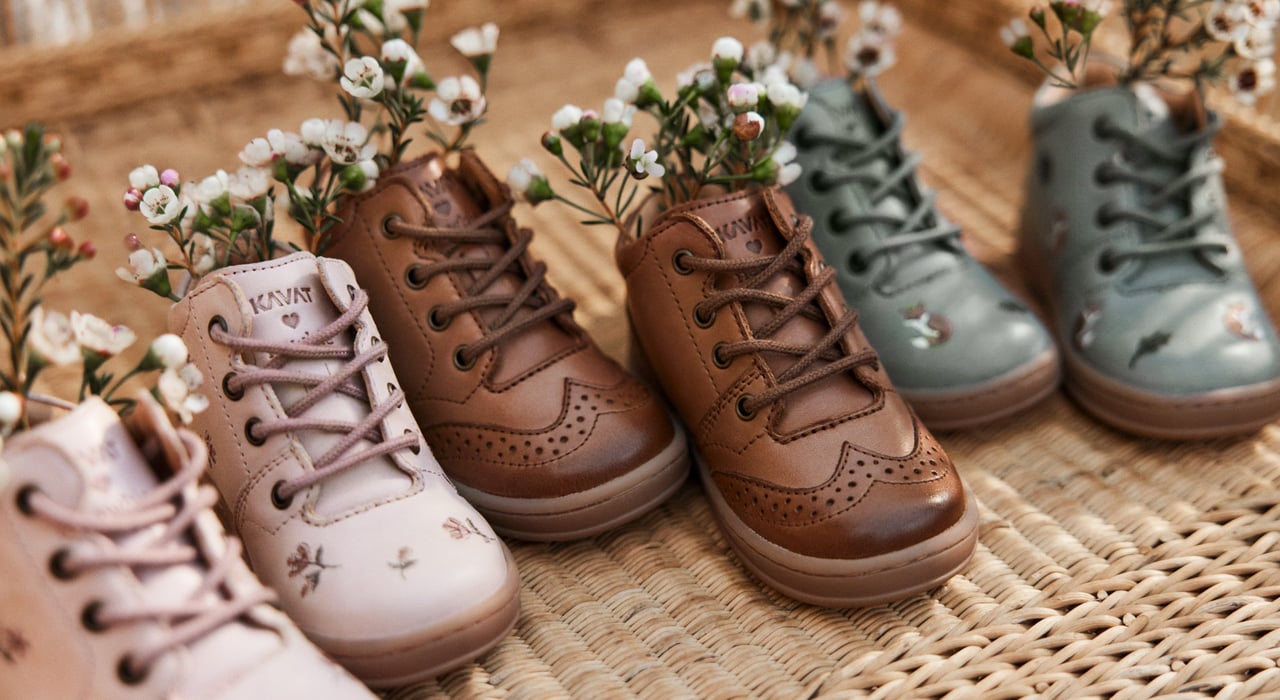 Pre-walker shoes with flowers in them