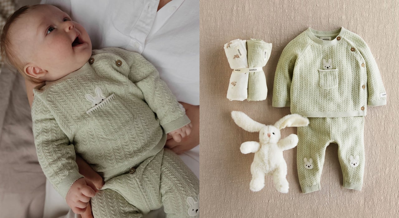 Baby wearing a green outfit with bunny print