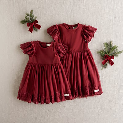 Two red festive dresses with lace-trimmed flutter sleeves and decorative lace hems.