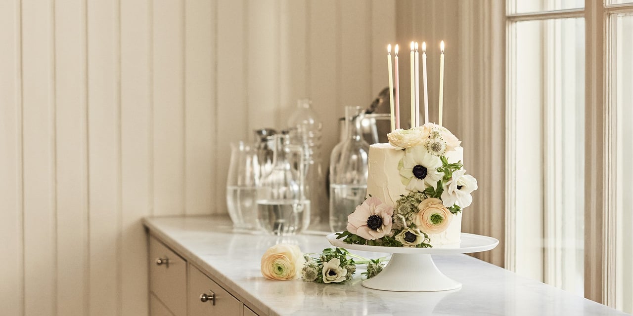Cake with flowers on a kitchen bench