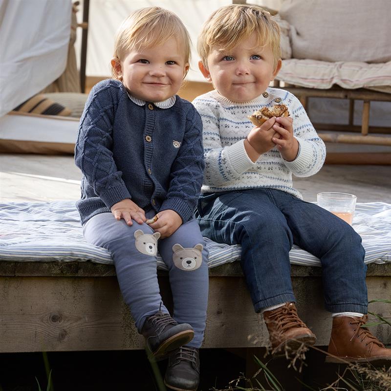 Boys in matching blue outfits