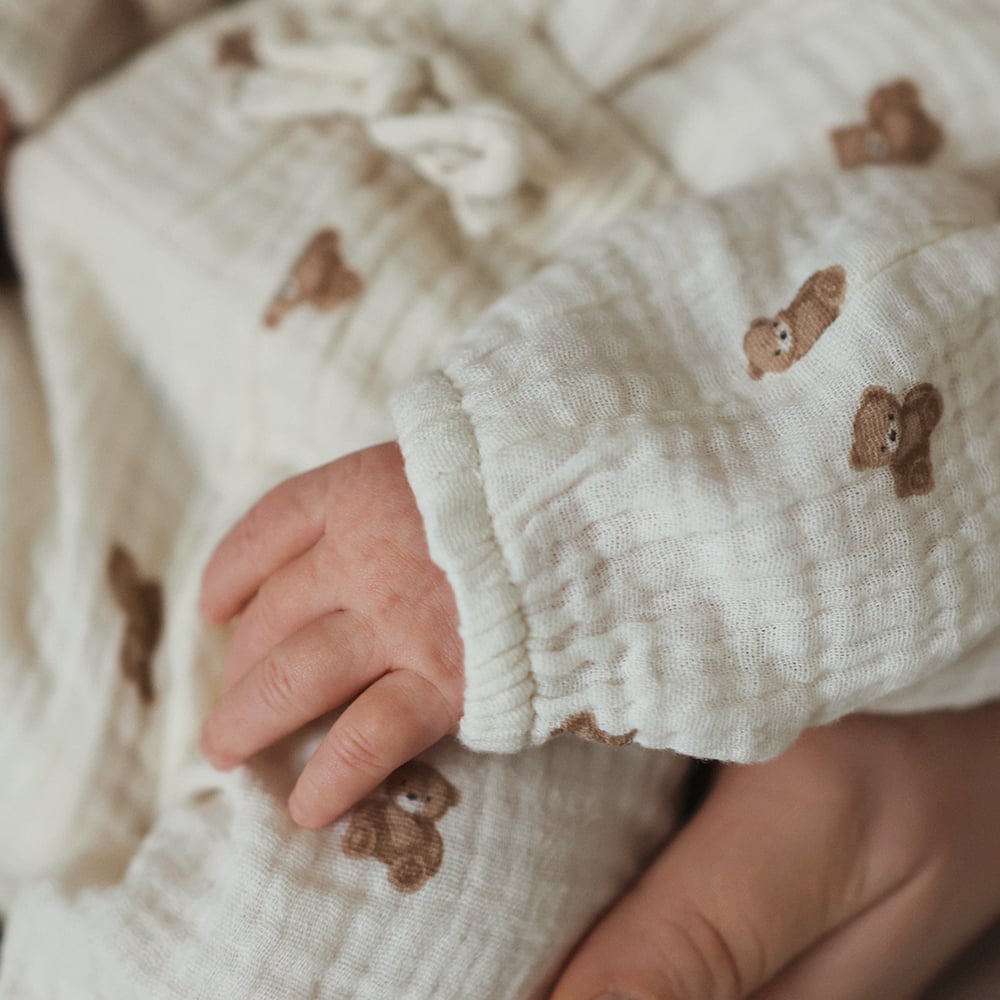 Newborn baby in muslin body