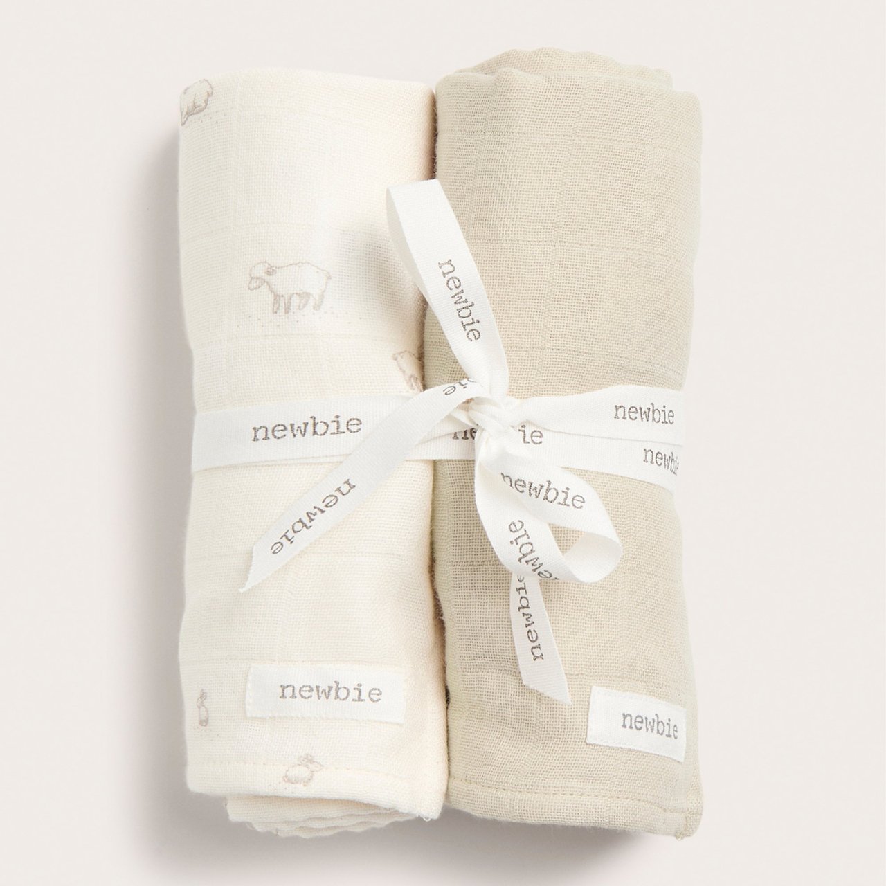 Two blankets, a white and beige