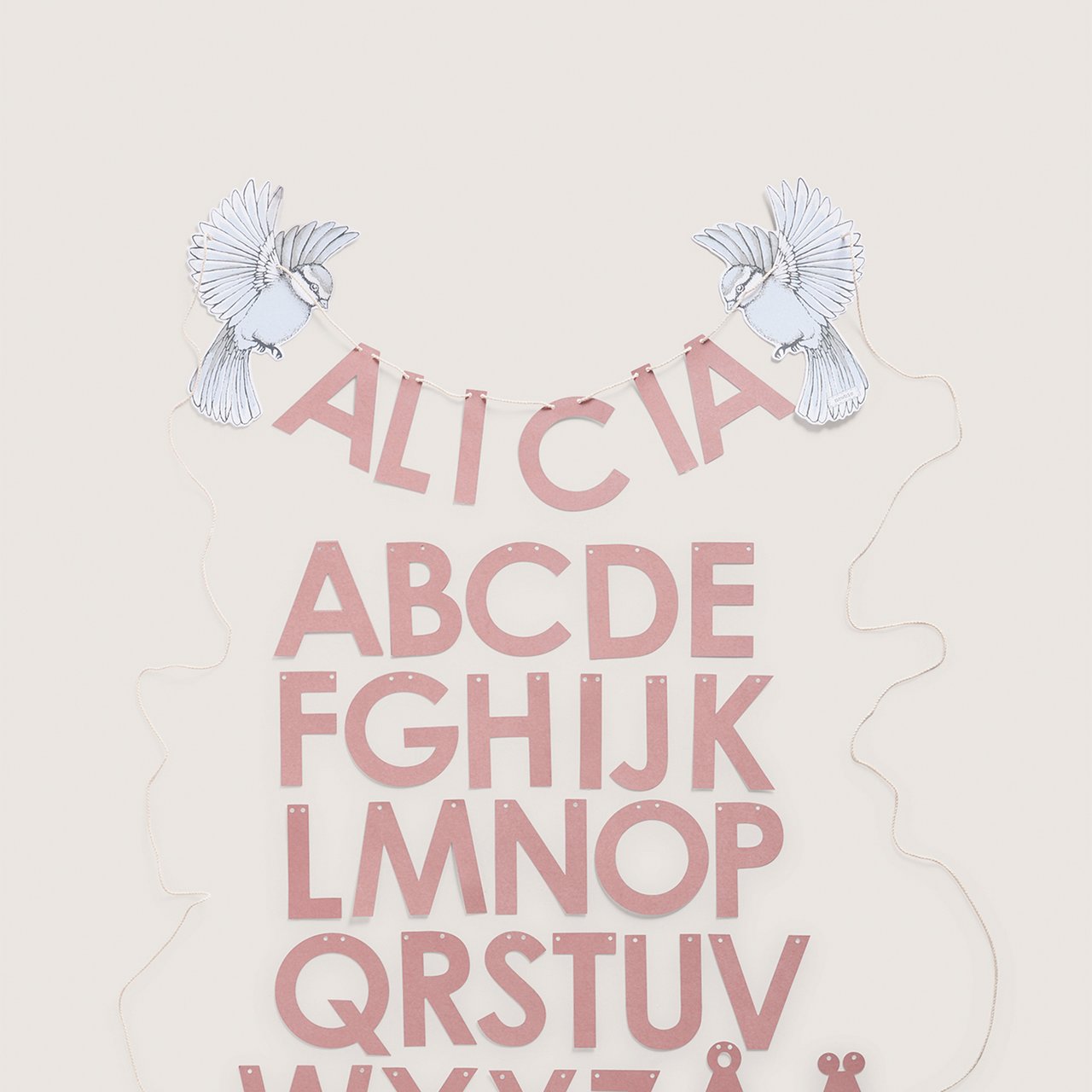A garland spelling the name "Alicia"
