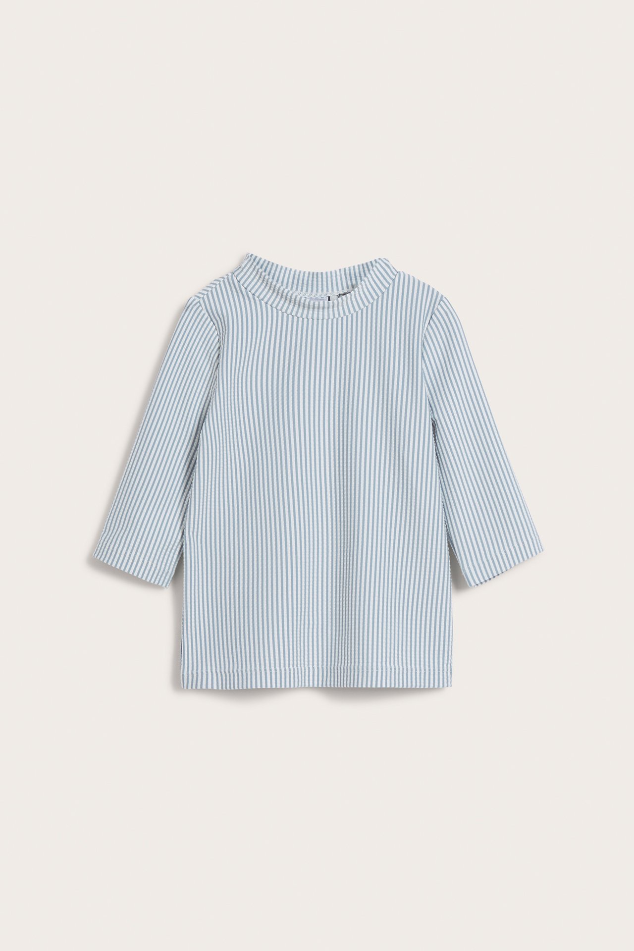 Front view: Baby/kid's blue and white striped seersucker UV top with three-quarter sleeves, mock neck.