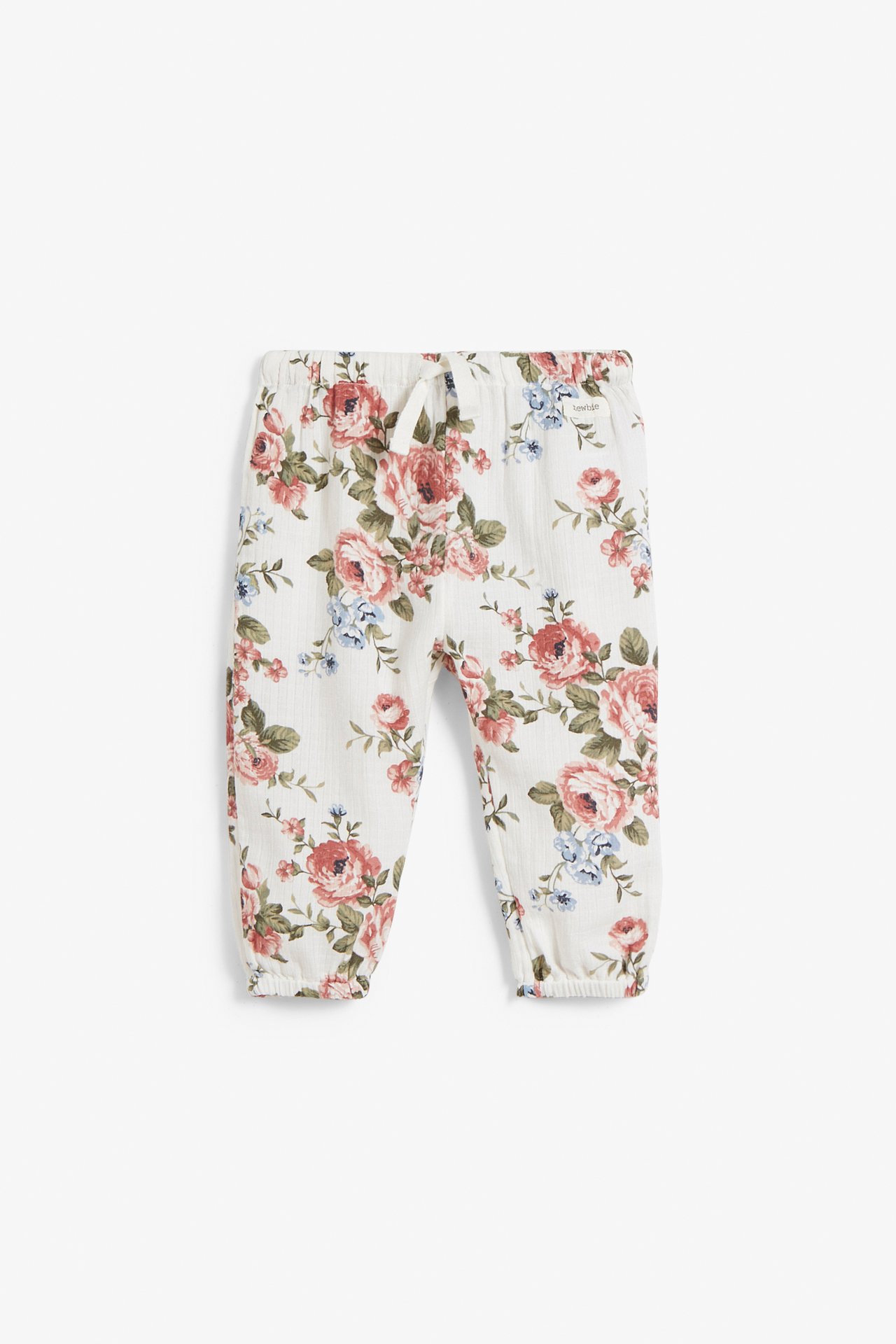 Front view: Off-white baby pants with pink and blue floral pattern, elastic waist, drawstring, and elastic leg ends.