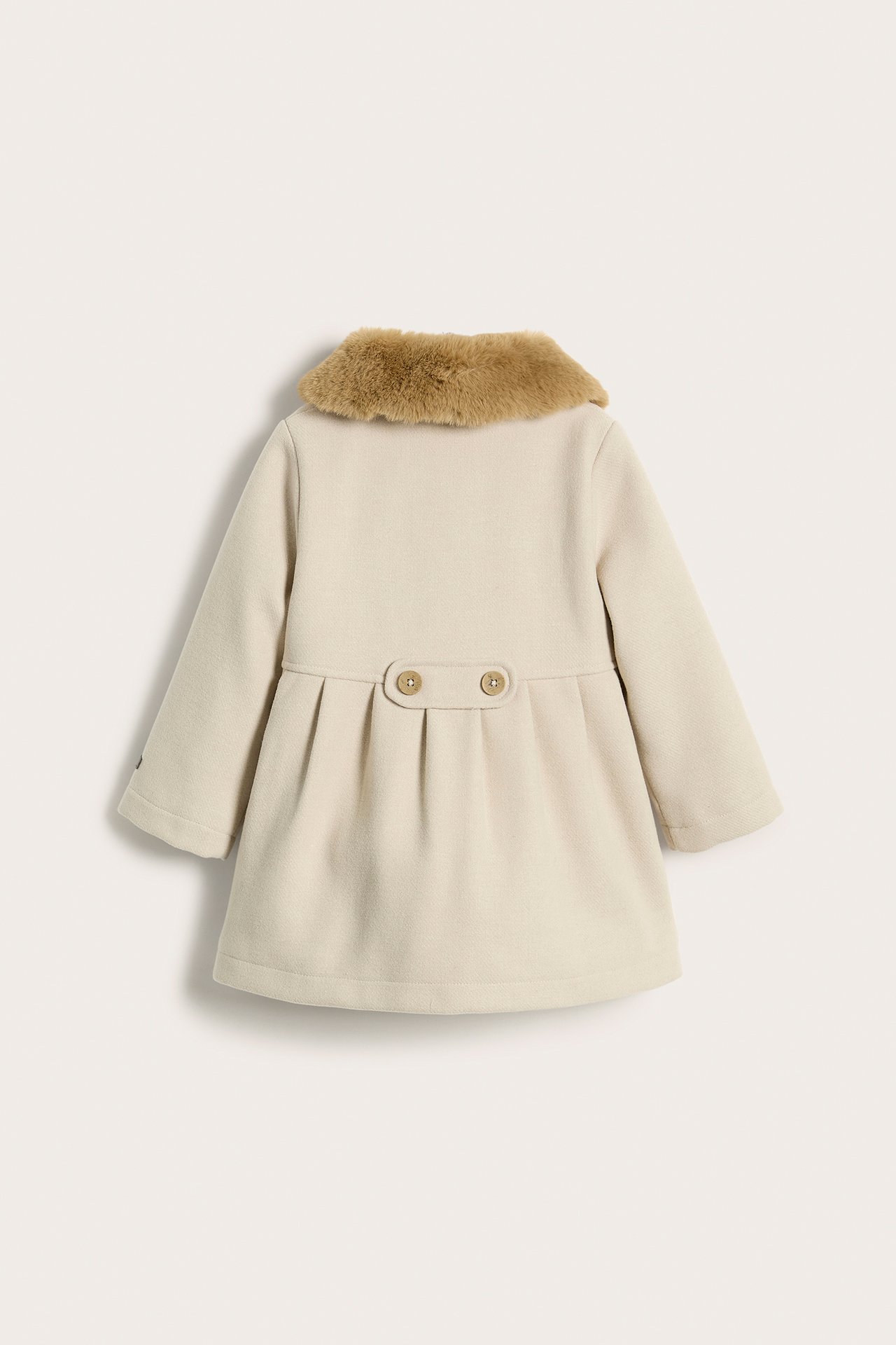 Back view of a kid's beige woven coat with a brown faux fur collar and decorative back strap.