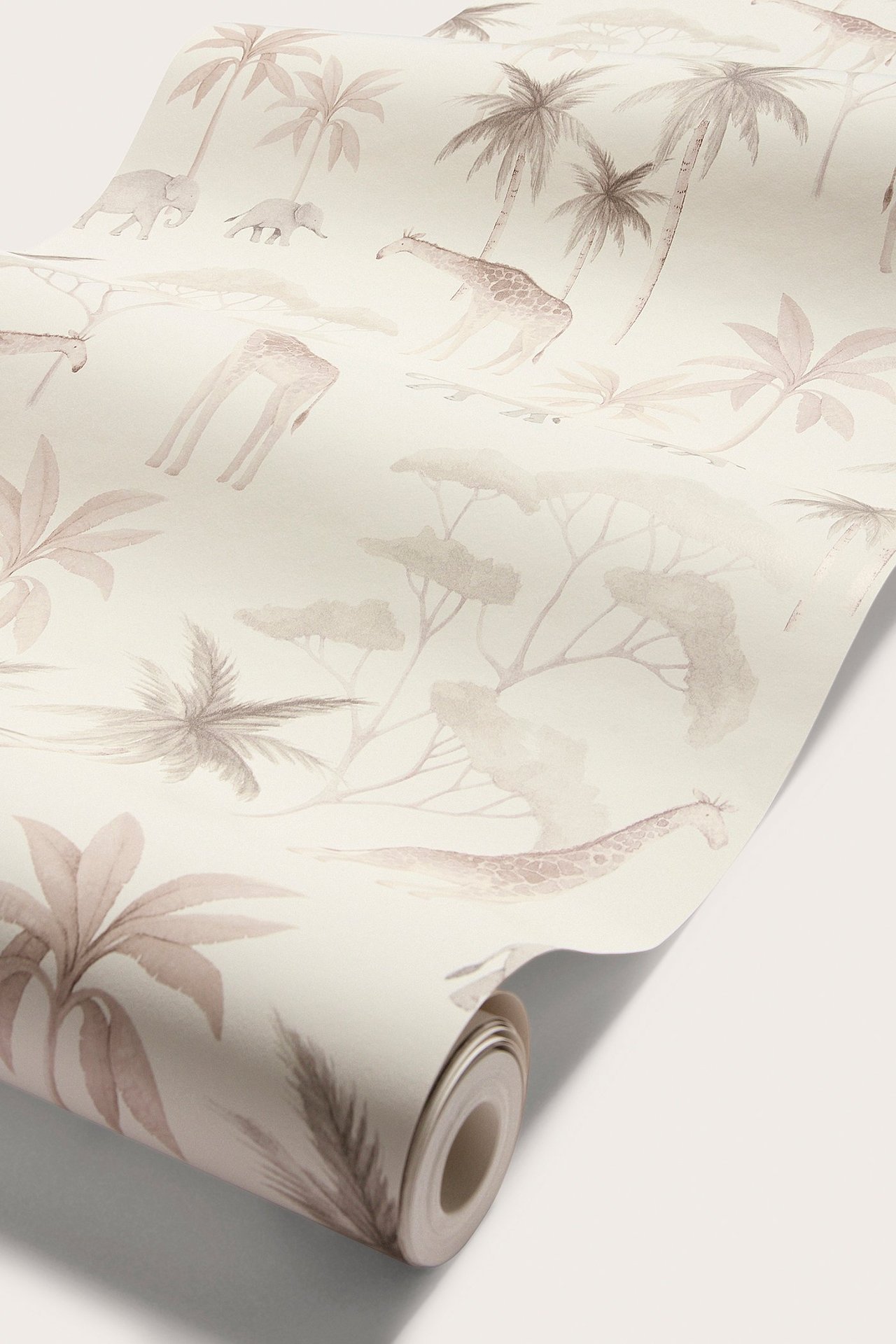 Close-up of a beige wallpaper roll with a savanna animal pattern, including giraffes, elephants, and palm trees.