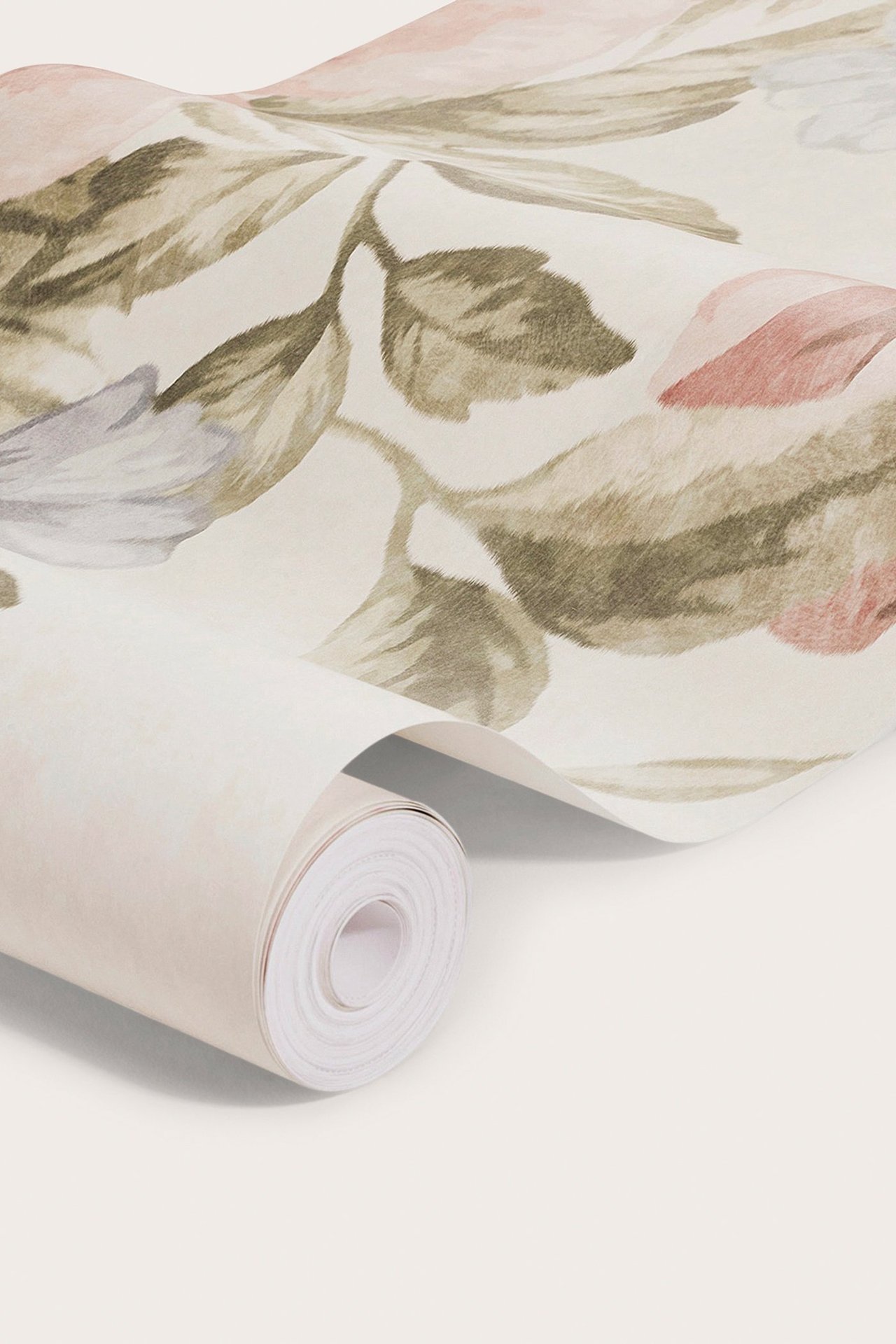 Close-up of a partially unrolled beige paper wallpaper mural with a soft floral pattern.
