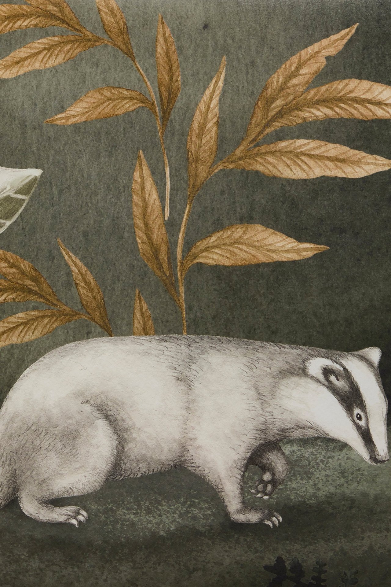 Close-up of a green non-woven wallpaper mural with an animal pattern depicting a badger and brown leaves.