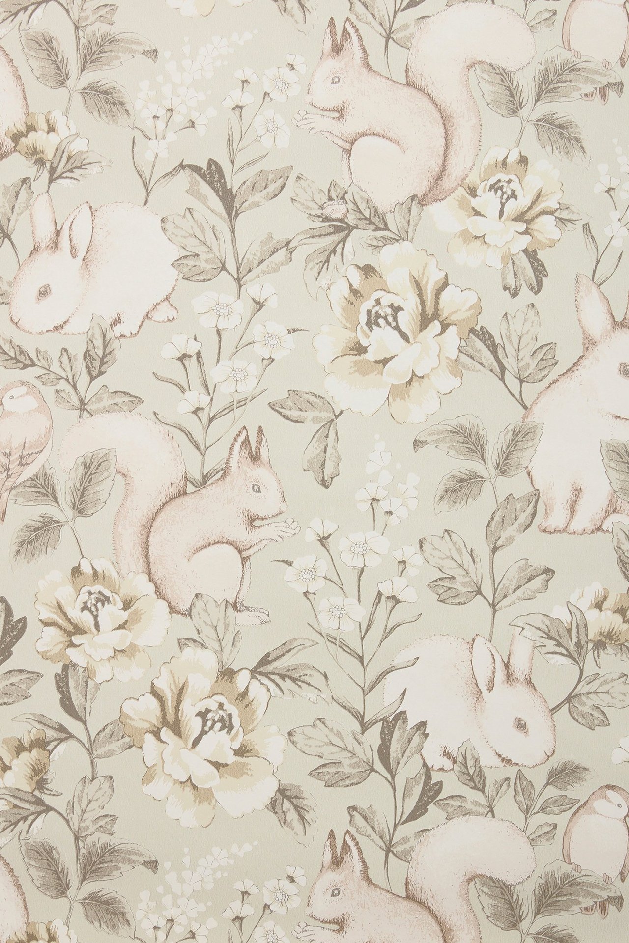 Close-up of beige patterned non-woven wallpaper with squirrels, bunnies, birds, and light-colored flowers.