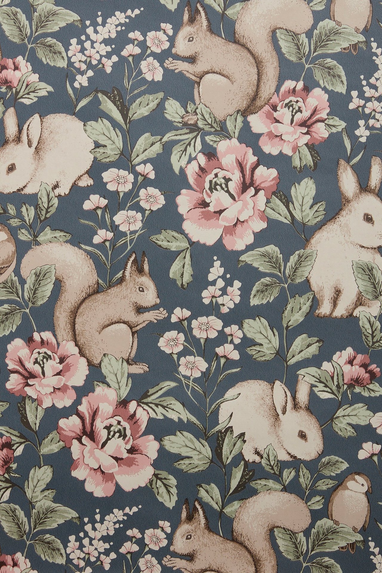 Close-up of blue patterned wallpaper with squirrels, rabbits, pink peonies, and white flowers.