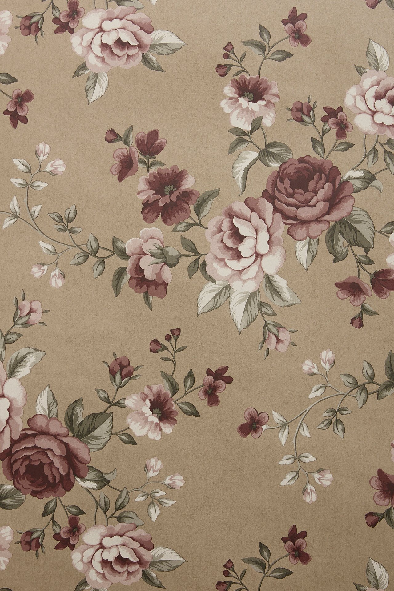 Full view of light brown non-woven wallpaper patterned with pink and burgundy flowers and green leaves.