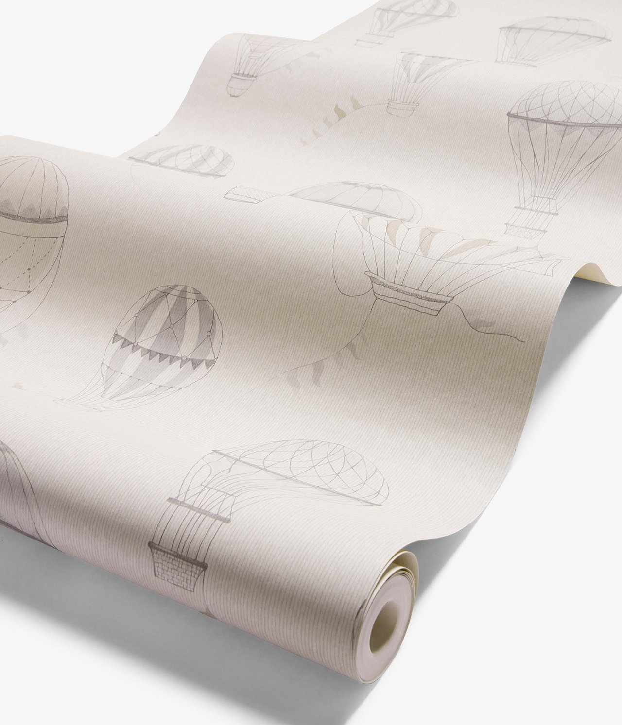 Nahaufnahme einer beigen Vliestapetenrolle mit grauem und beigem Heißluftballonmuster.