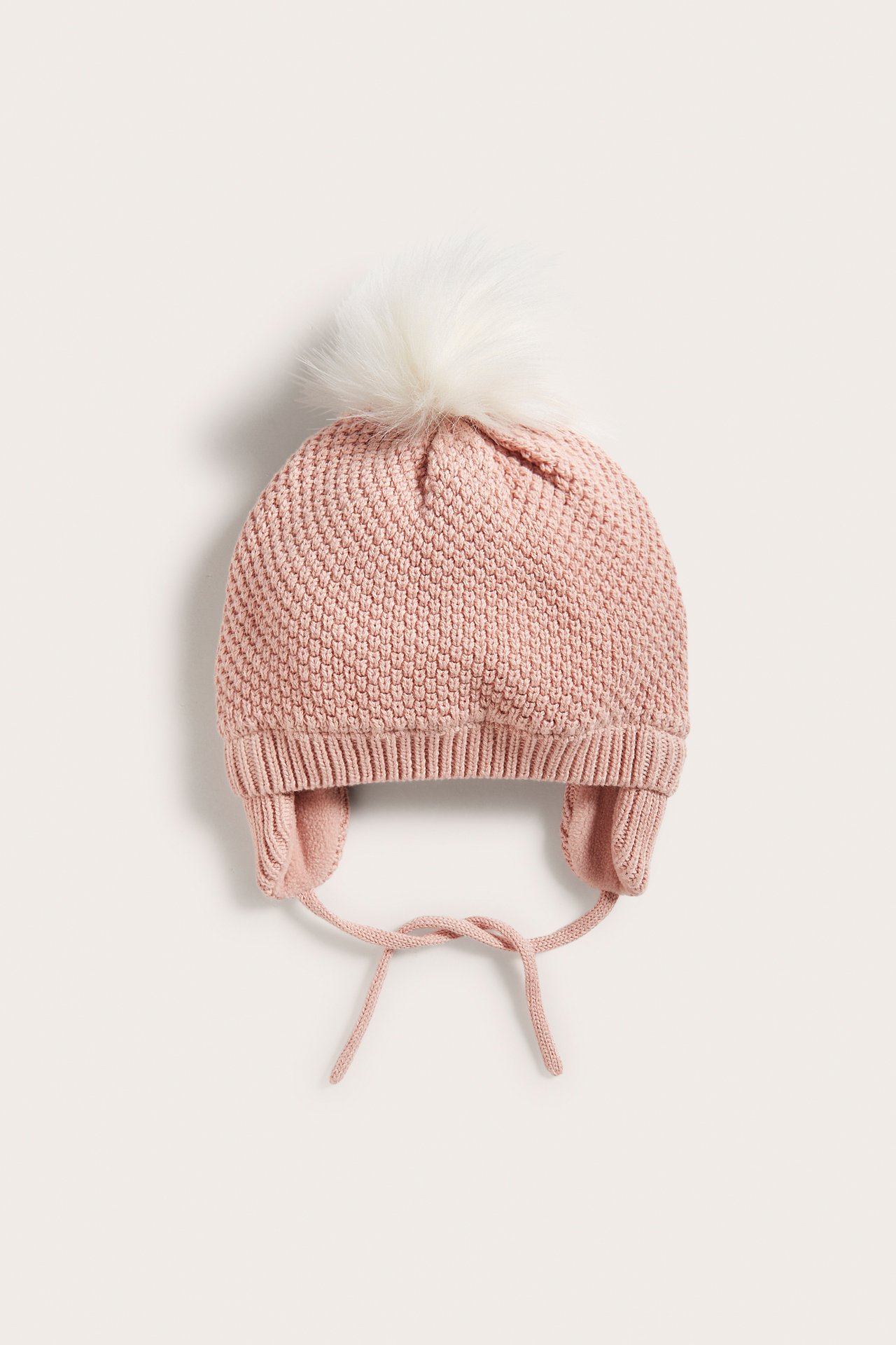 Knitted pom-pom hat with ear flaps