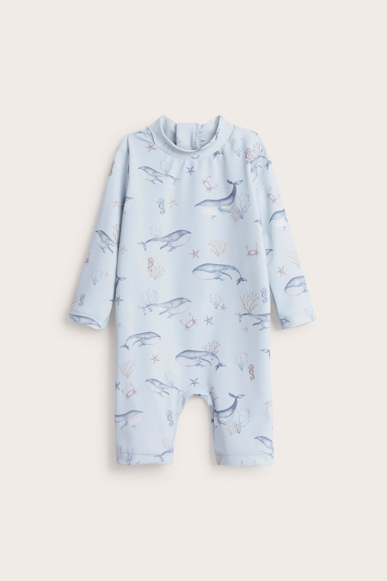 Front view: Light blue baby UV suit with long sleeves, short legs, sea creature pattern, back zipper.