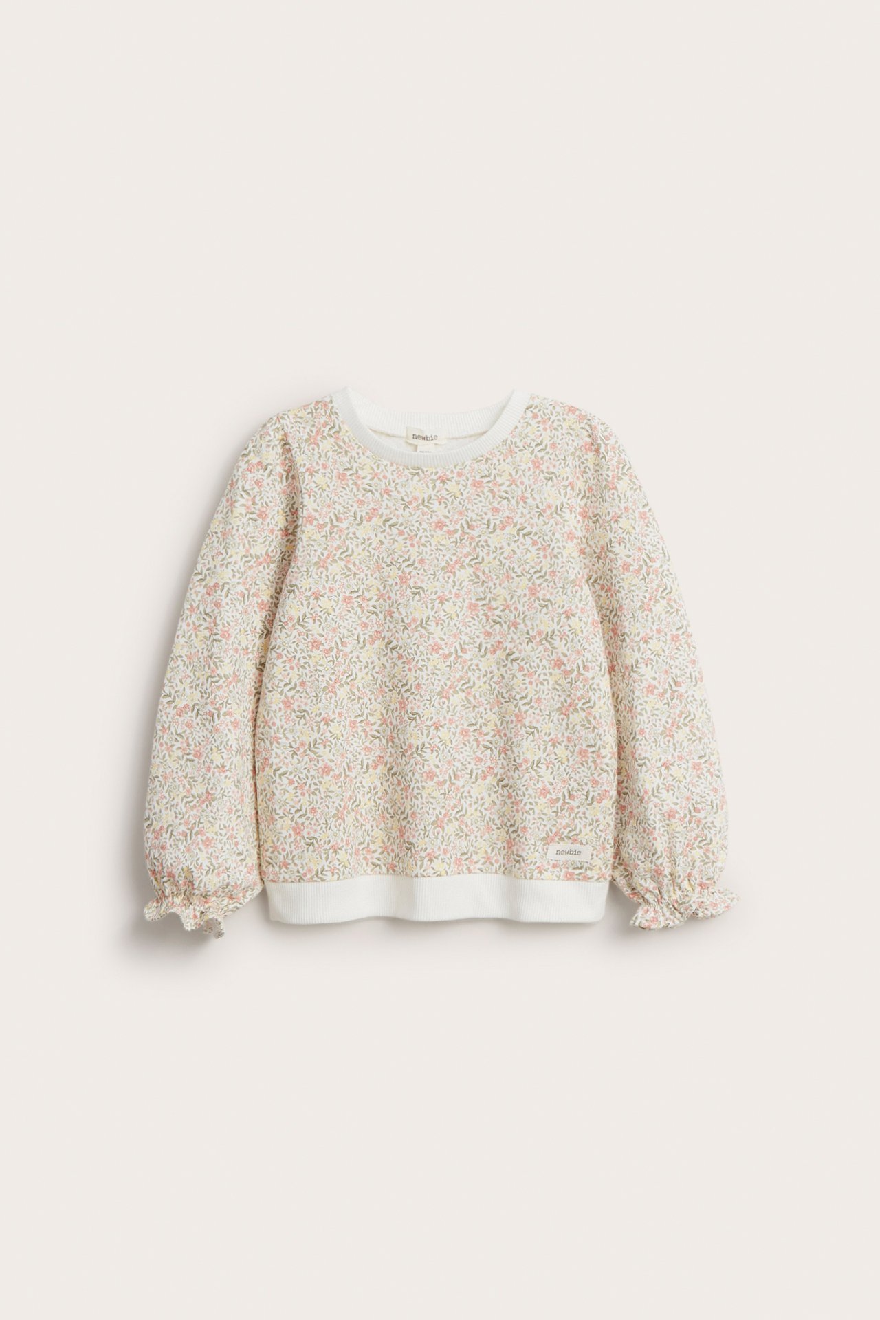 Front view of a kid's off-white cotton sweatshirt with a delicate floral print and frilled puff sleeves.