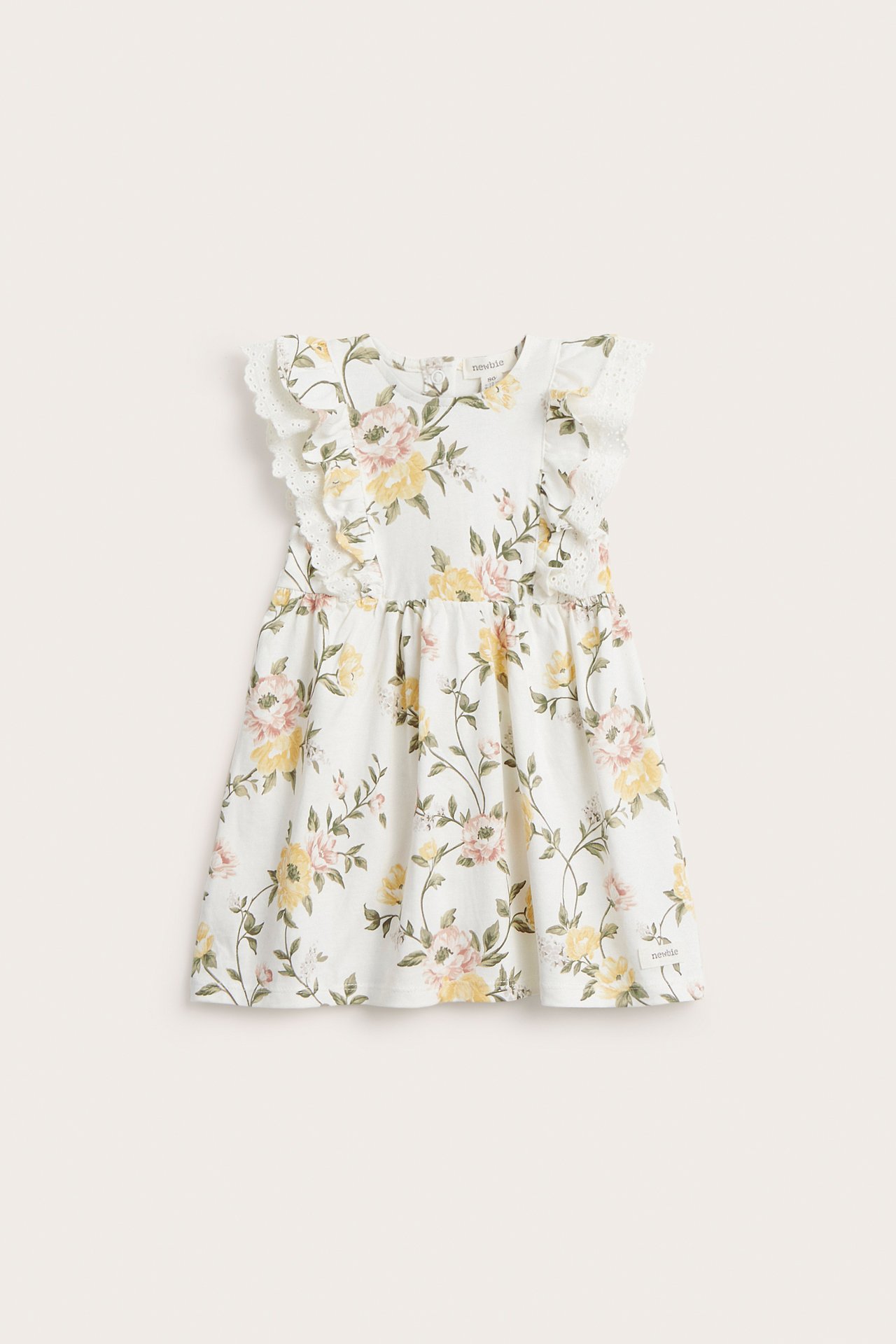 Vorderansicht eines cremeweißen ärmellosen Kinderkleides aus Baumwolle mit gelbem und rosa Blumenmuster und Spitzenrüschen.