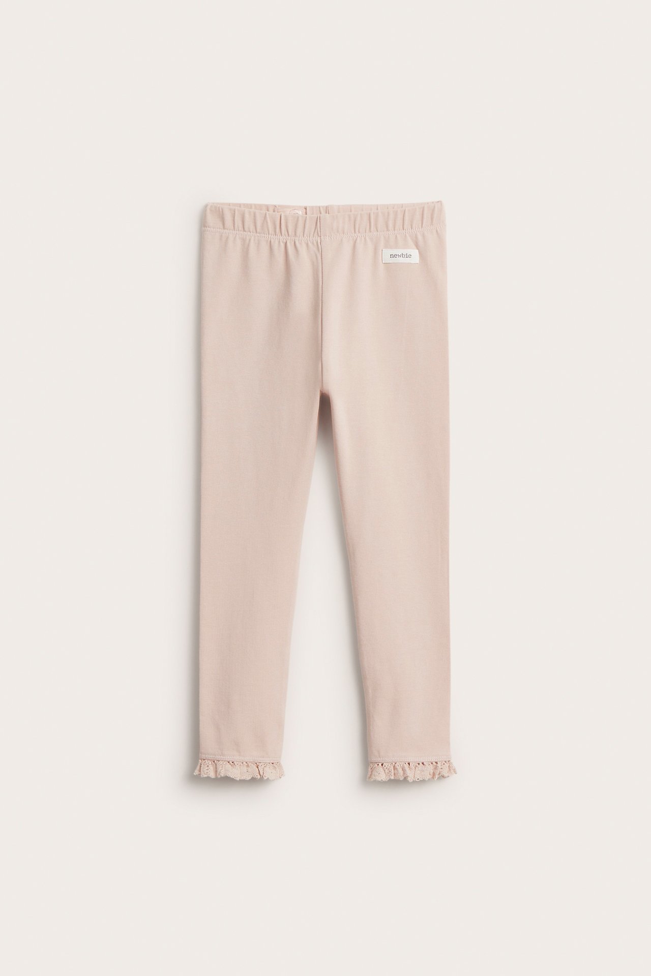 Front view of light pink cotton blend leggings with lace ruffle at leg openings and an elastic waist.