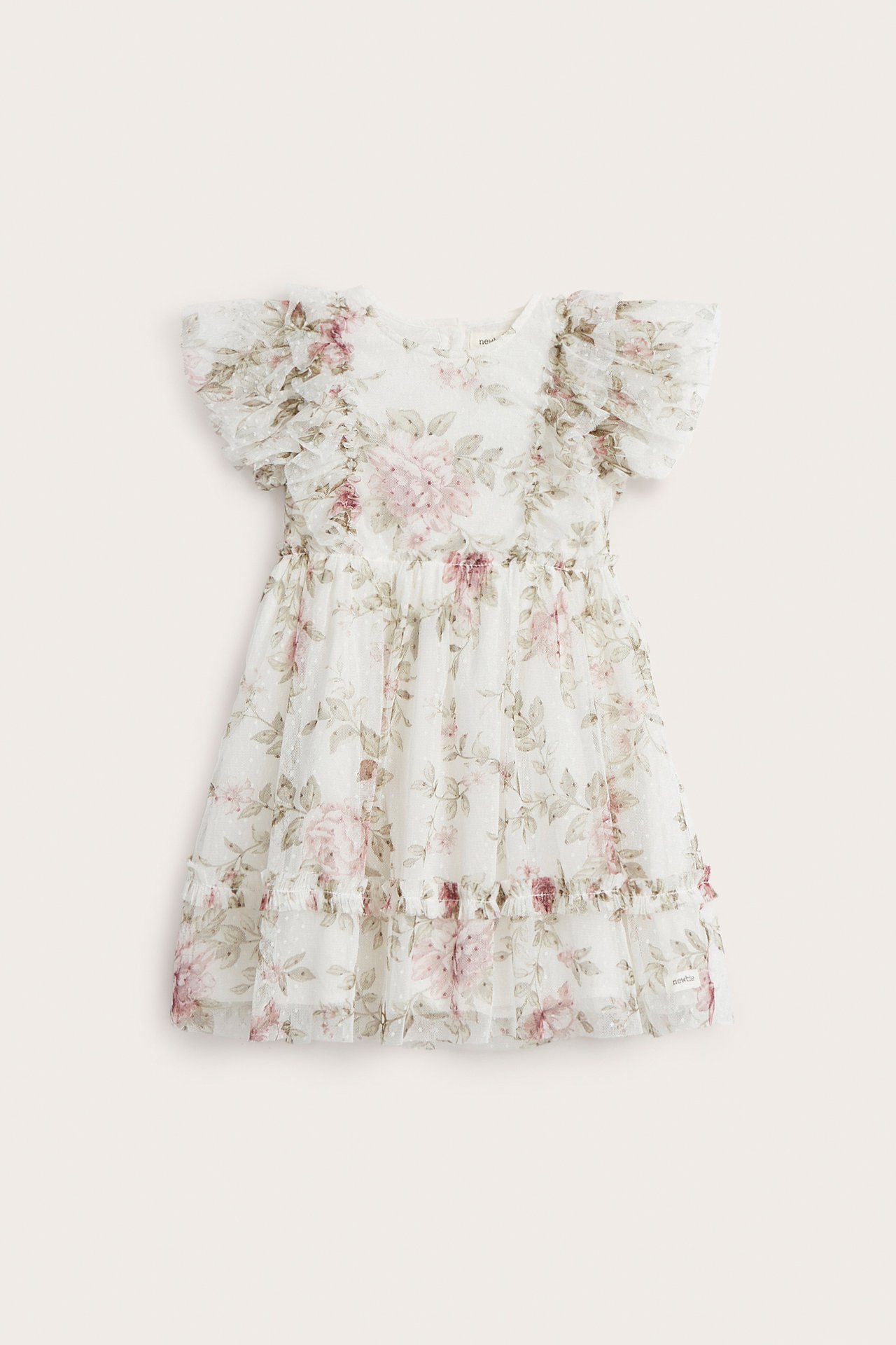 Front view of an off-white kid's mesh dress with pink floral print, ruffle sleeves, and dotted texture.