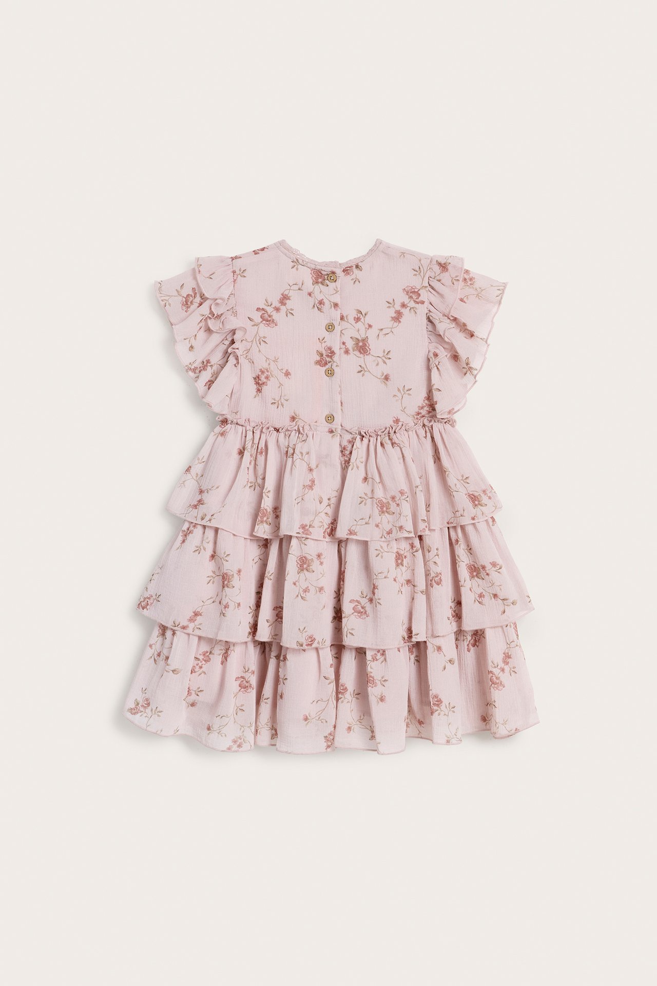 Front view of a kid's pink floral chiffon tiered dress with short ruffled sleeves and back buttons.