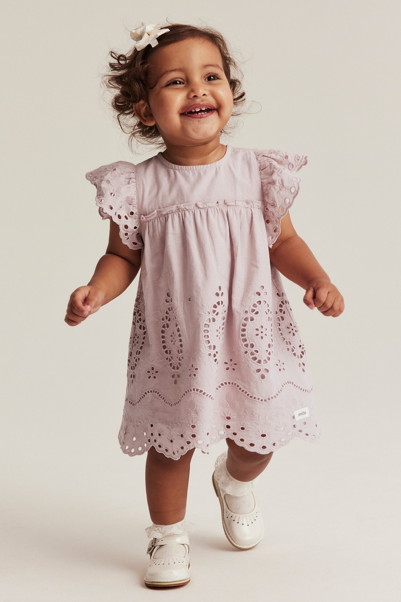 Embroidered dress with frill