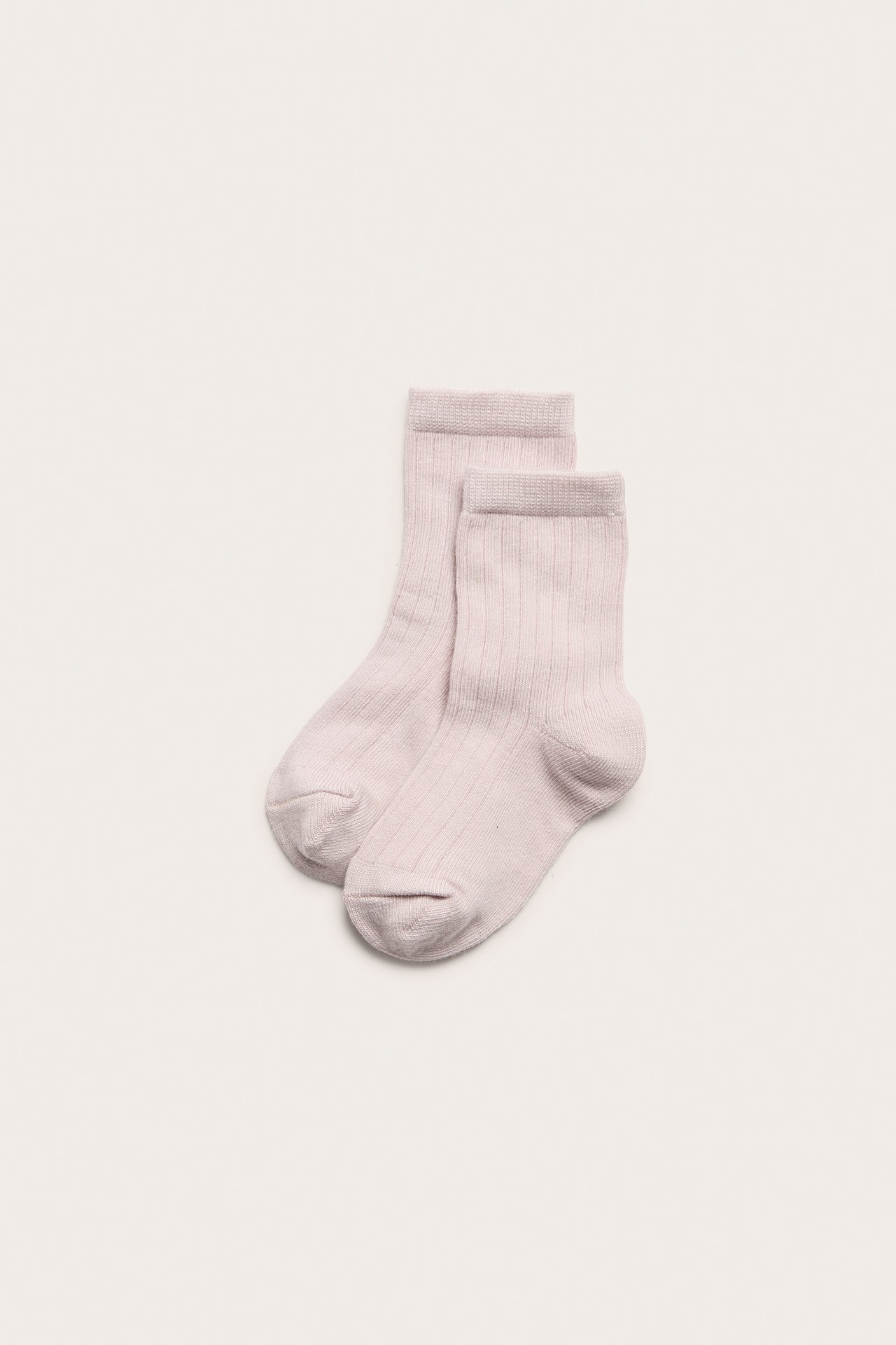 Top view of a pair of light lilac solid ribbed socks made of cotton blend.