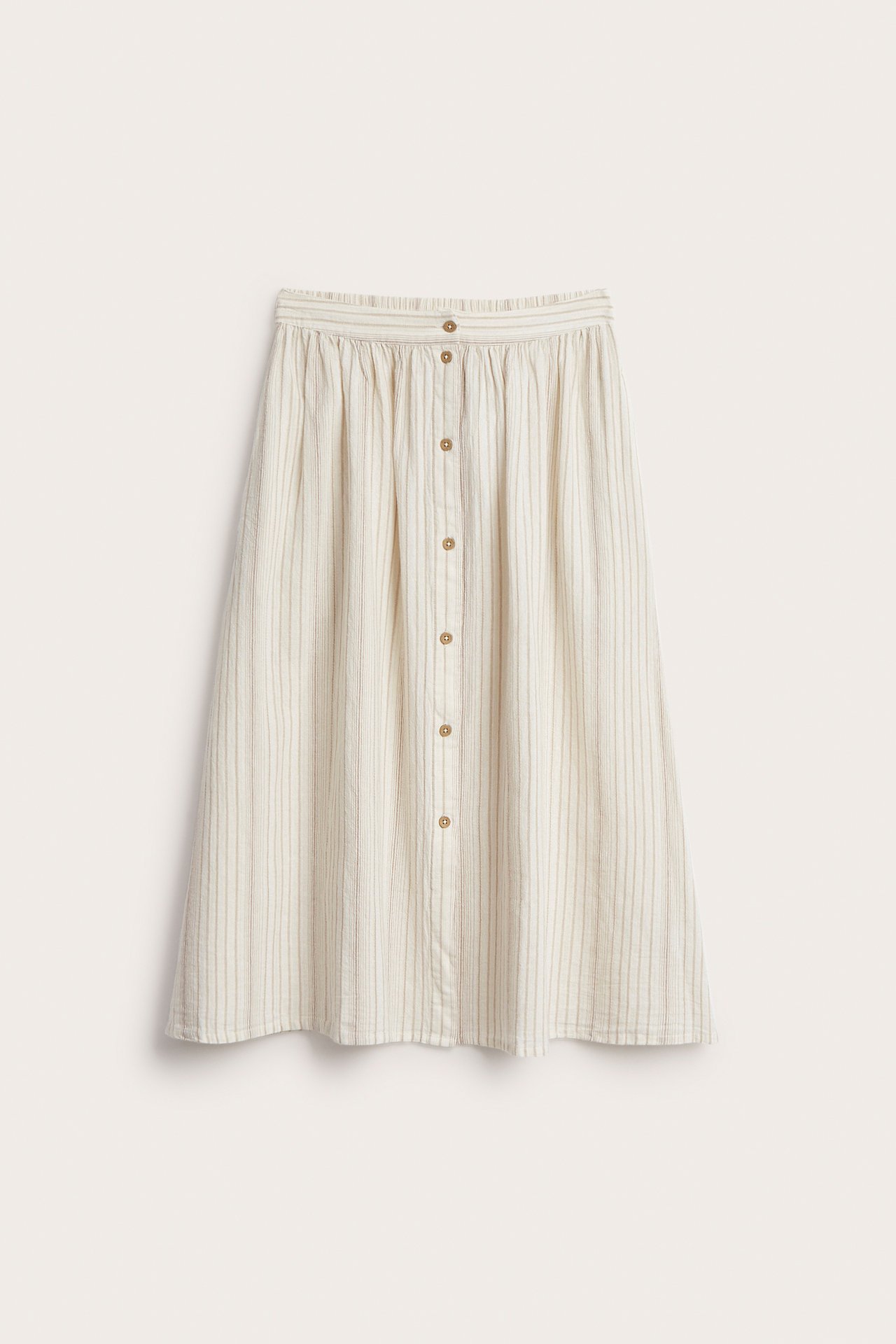 Front view of an off-white striped woven cotton midi skirt with an elastic waist and full button front.